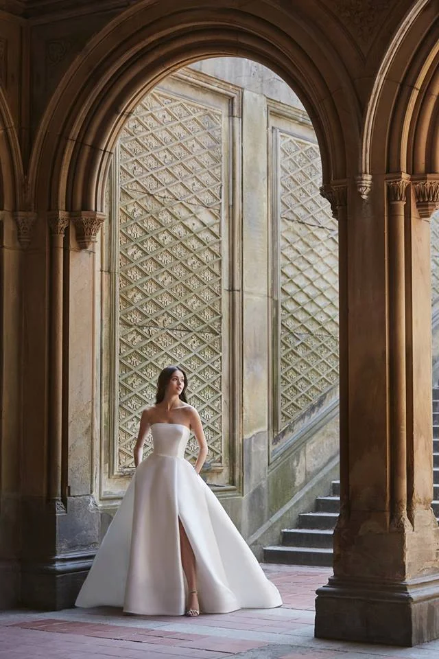 clean strapless ball gown with a slit by monique lhuillier