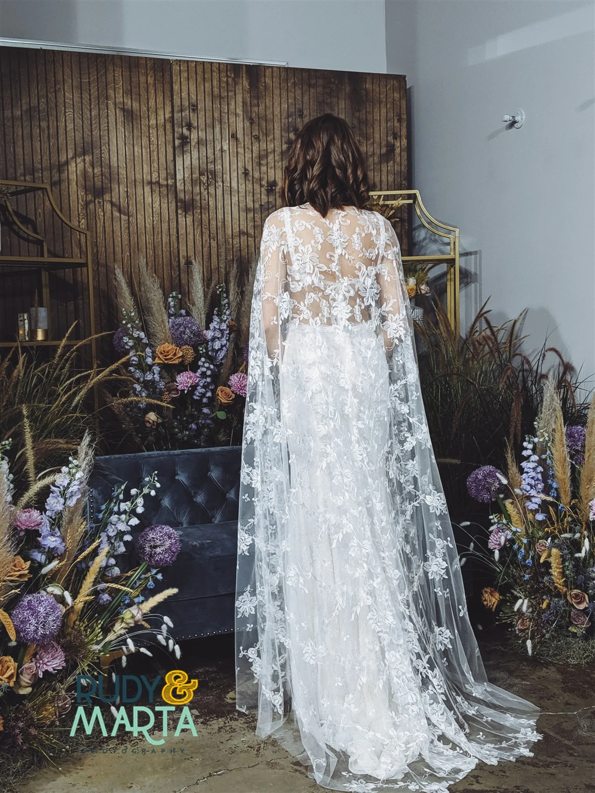 girl and a serious dream bridal lace cape in bloom florist central florida wedding vendors