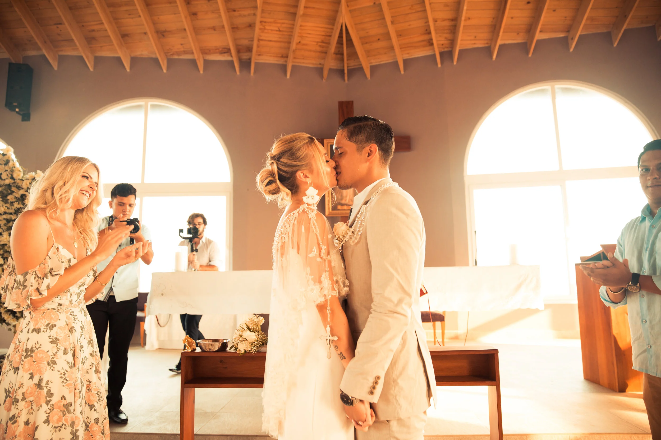 Daniele and Ivan got married in Honduras during a destination weekend to celebrate their marriage. Daniele’s dress is from The Bridal Finery. She styled it with a bridal cape and textured earrings.