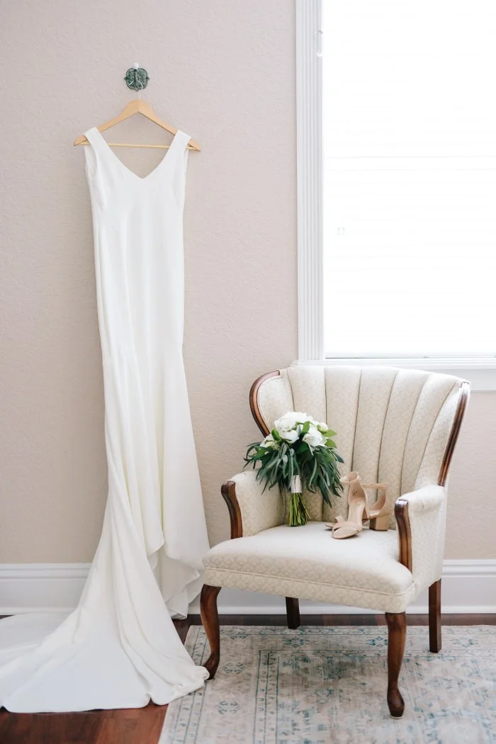 clean v-neck wedding dress with crepe train