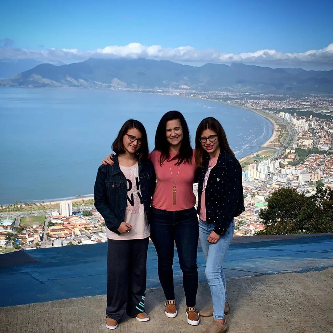 Roberta and her two daughters in Brazil this summer.