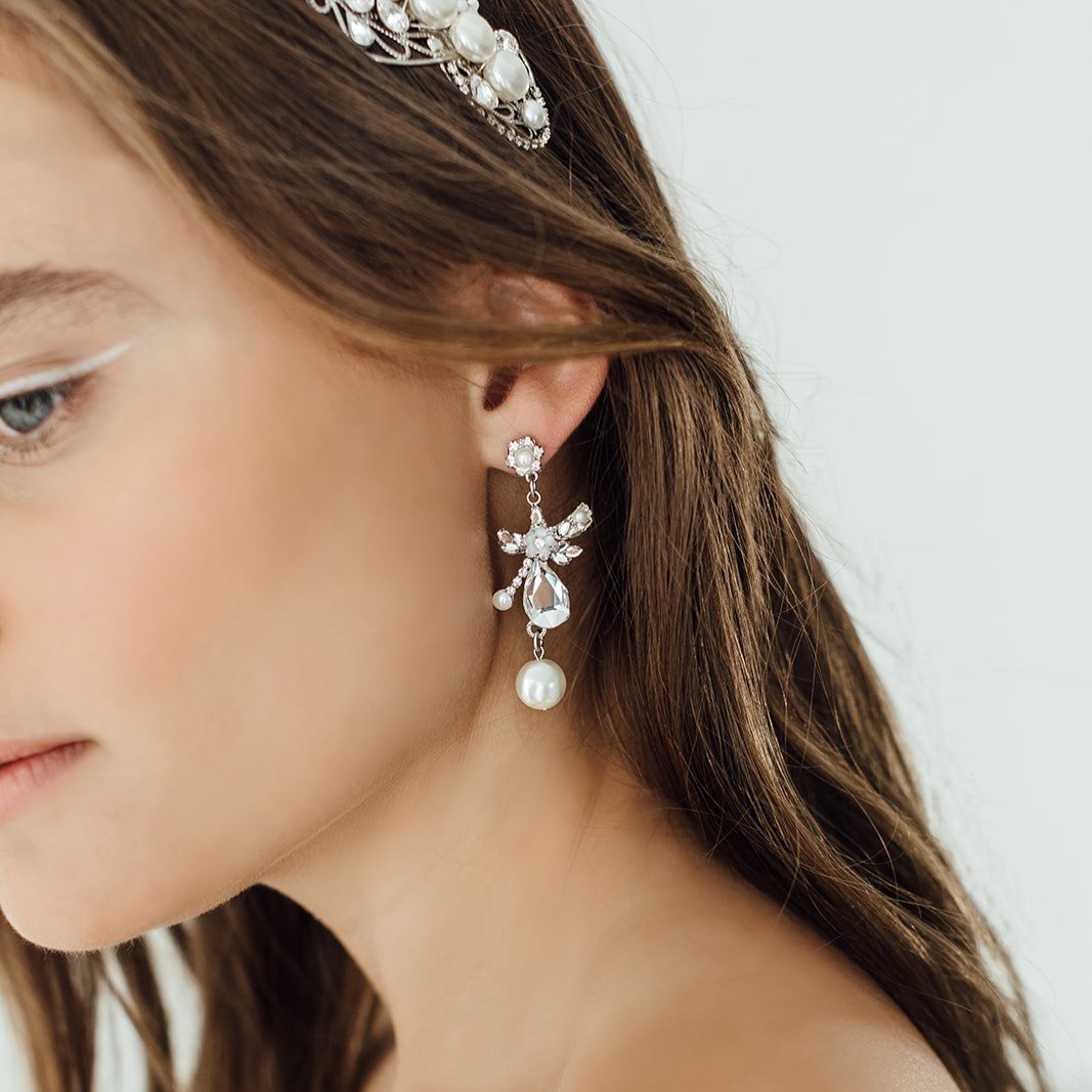 Dangle Gemini earrings by Maria Elena in silver