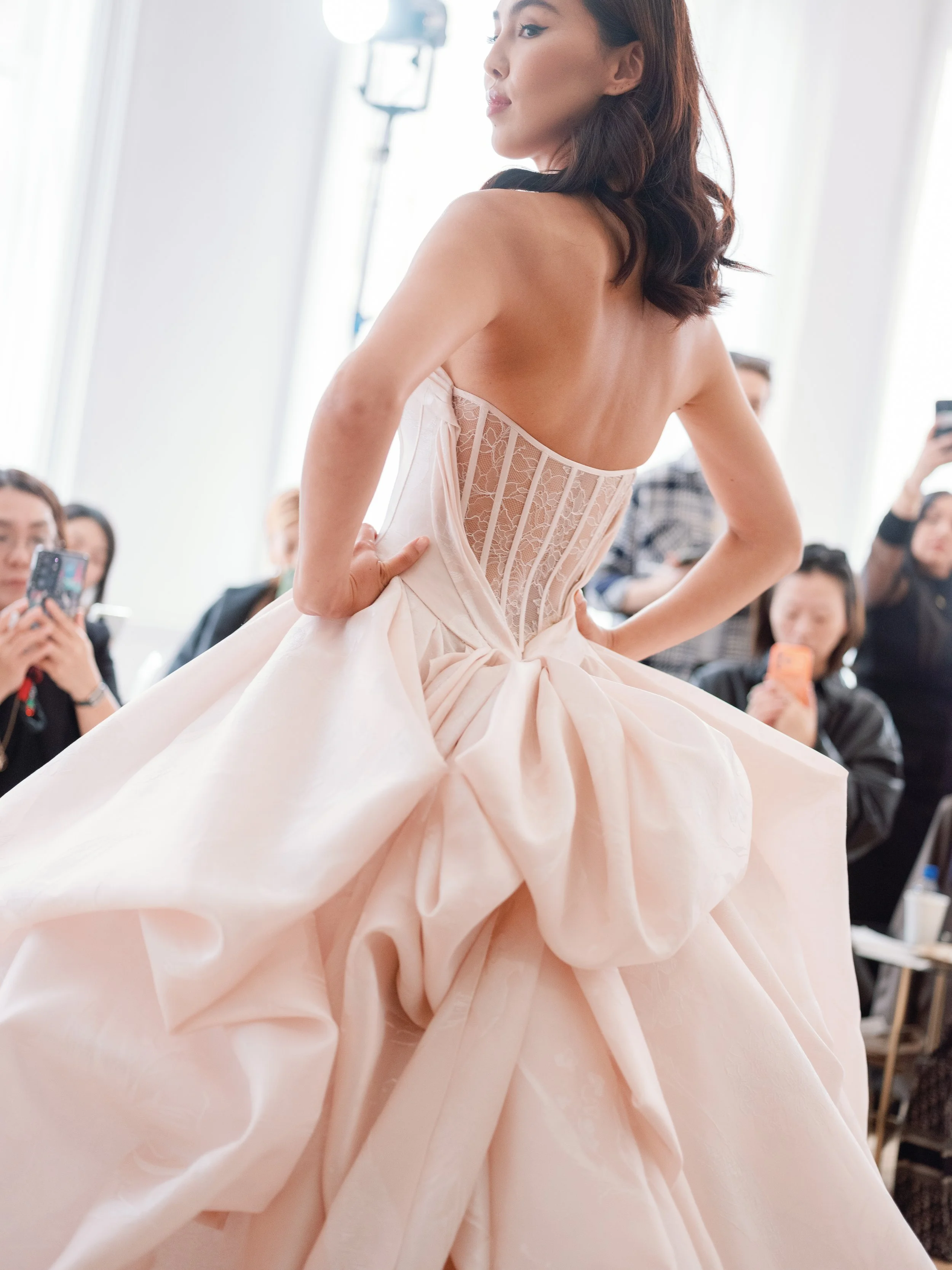 Pink ballgown wedding dress with lace back detail with jacquard print. Ines Di Santo ballgown wedding dress. Pink ballgown wedding gown with bow