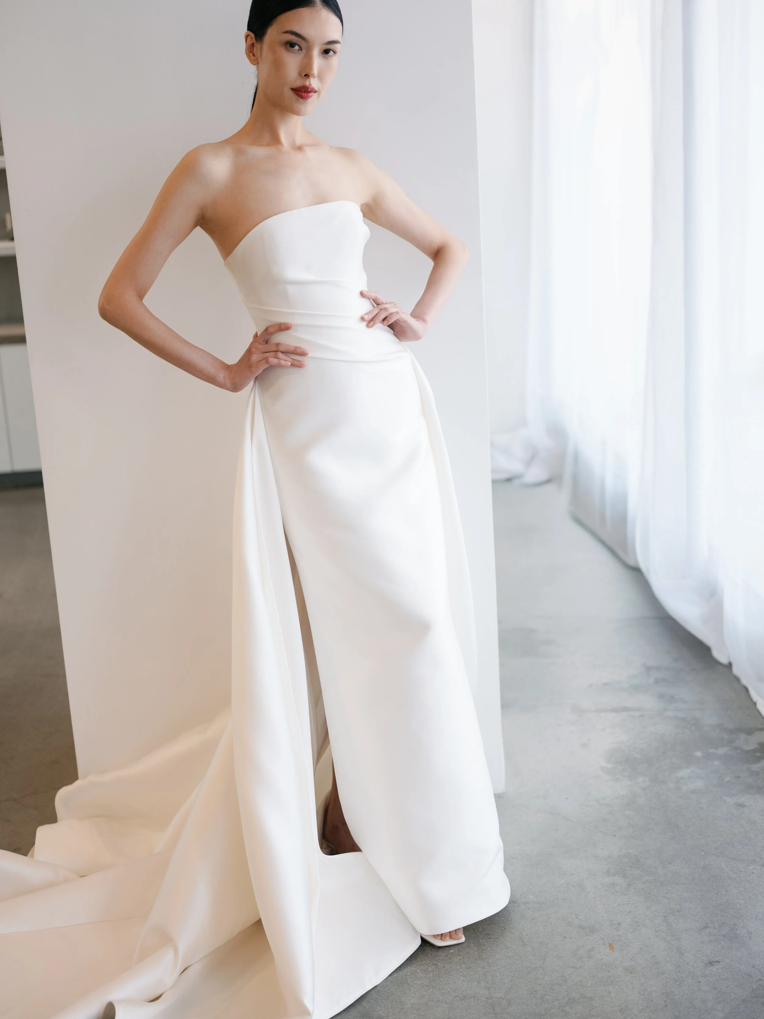 kyha ellery wedding dress in winter park. mikado wedding dress . clean wedding dresses with faux overskirt. double layer wedding dress. straight across neckline clean wedding dress.