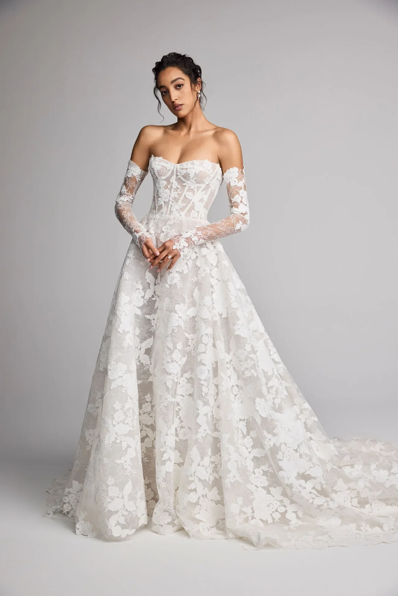lace aline wedding dress by ines di santo. featuring a soft lace neckline and long lace sleeves. The dress has lace details through out the bodice and the skirt.