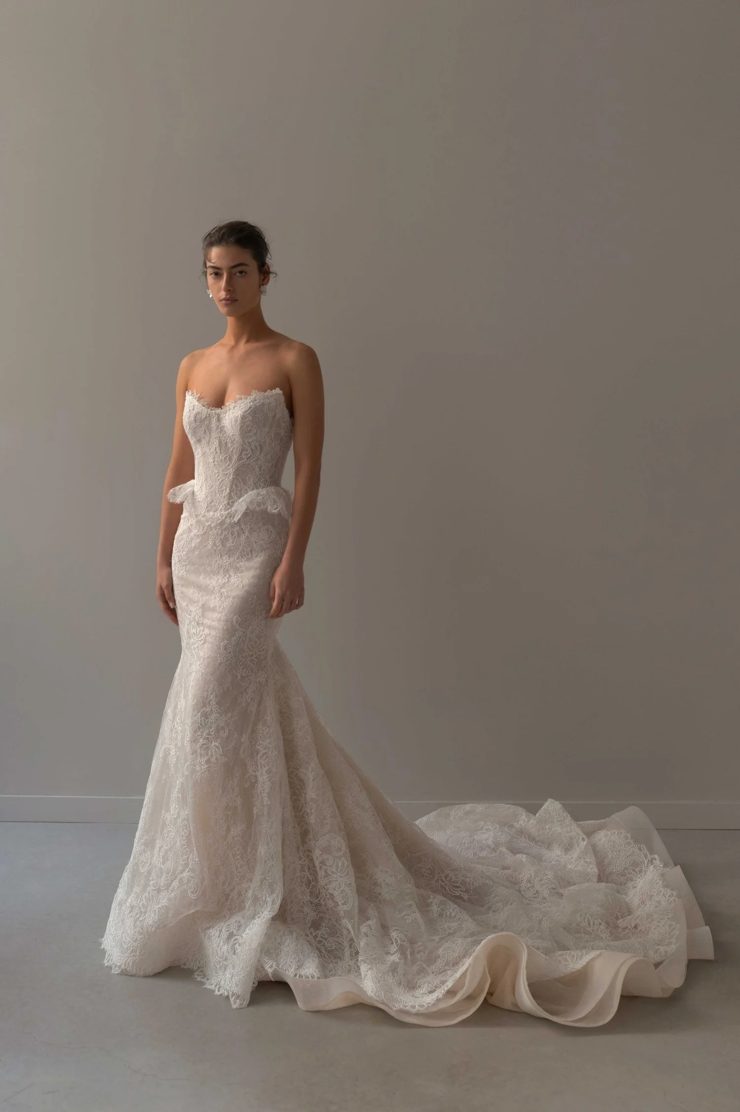 Fit-and-flare gown with floral Soutache lace with a strapless cat-eye neckline and peplum detail