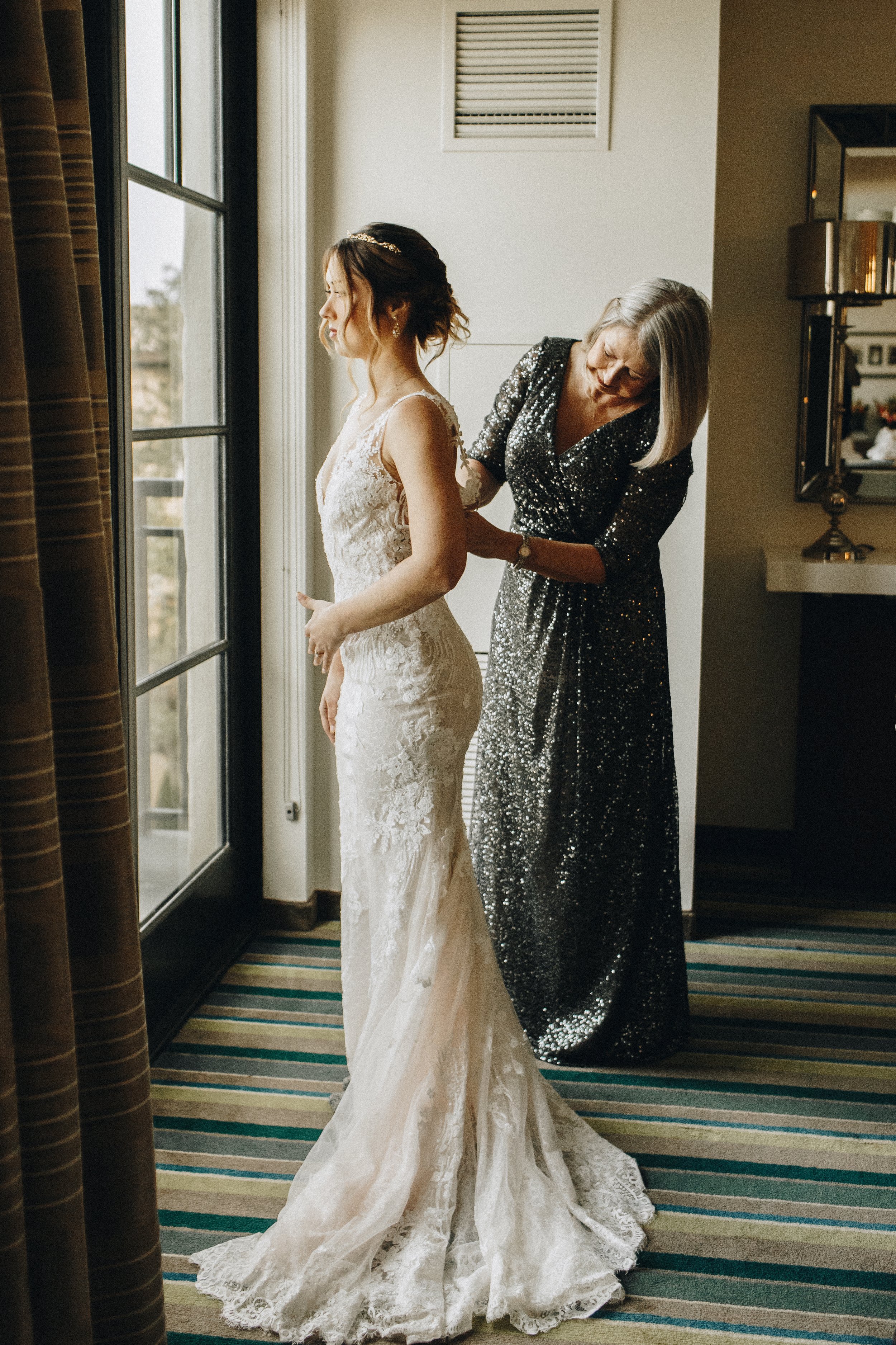 Mom helping bride get ready