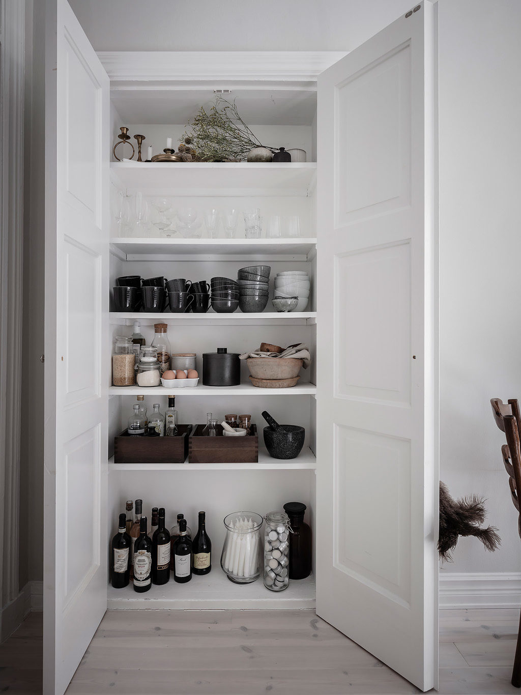 Make the pantry feel "fancy" by corralling like items in containers and boxes.