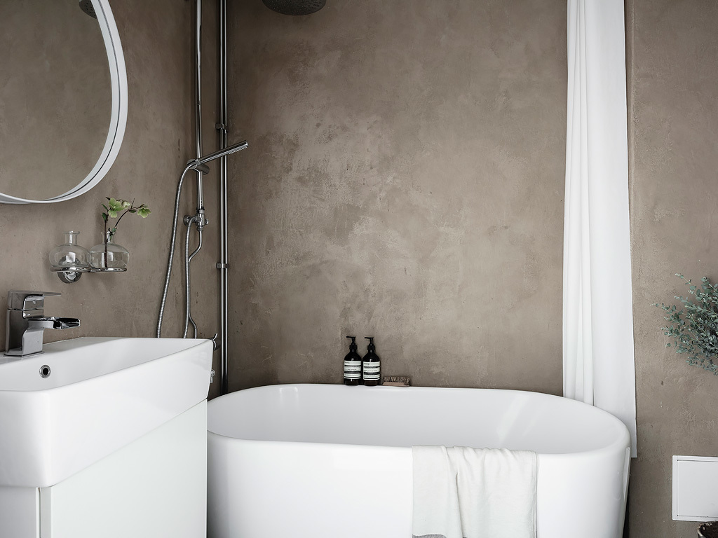 Consider rough plastered walls against a smooth modern tub or vanity.
