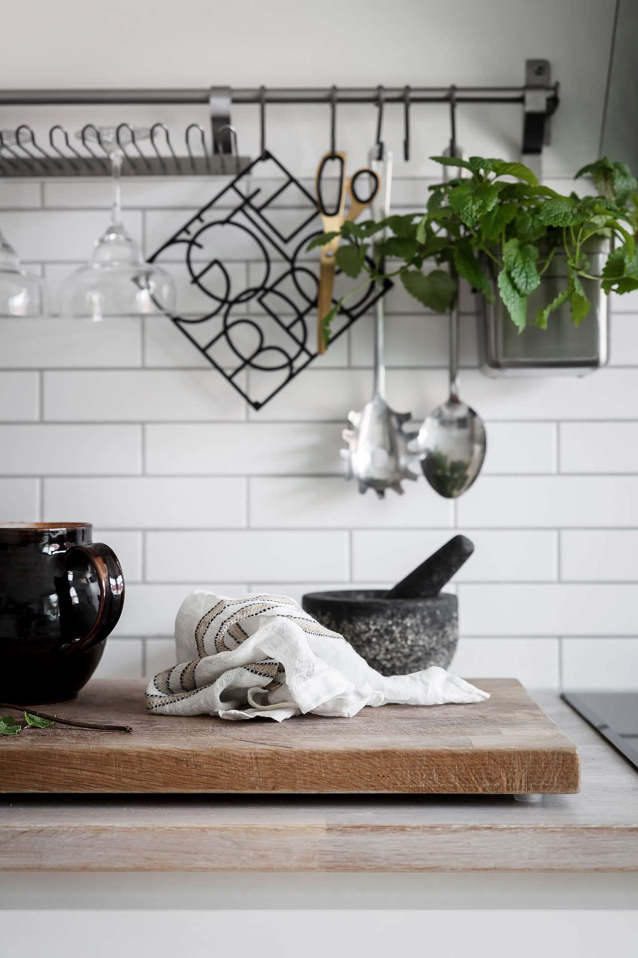 Blend Linen and stone against clean white subway tile 