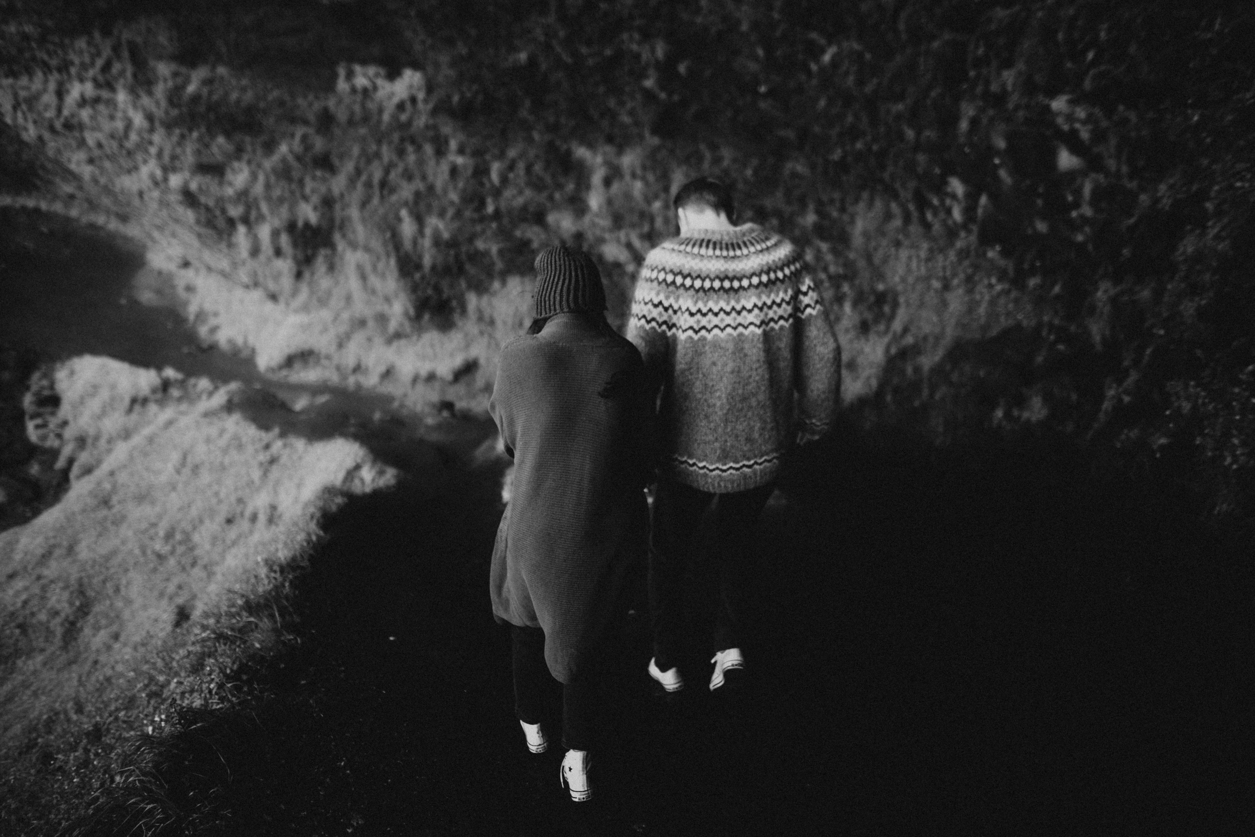 Couples photography behind an Icelandic Waterfal.jpg