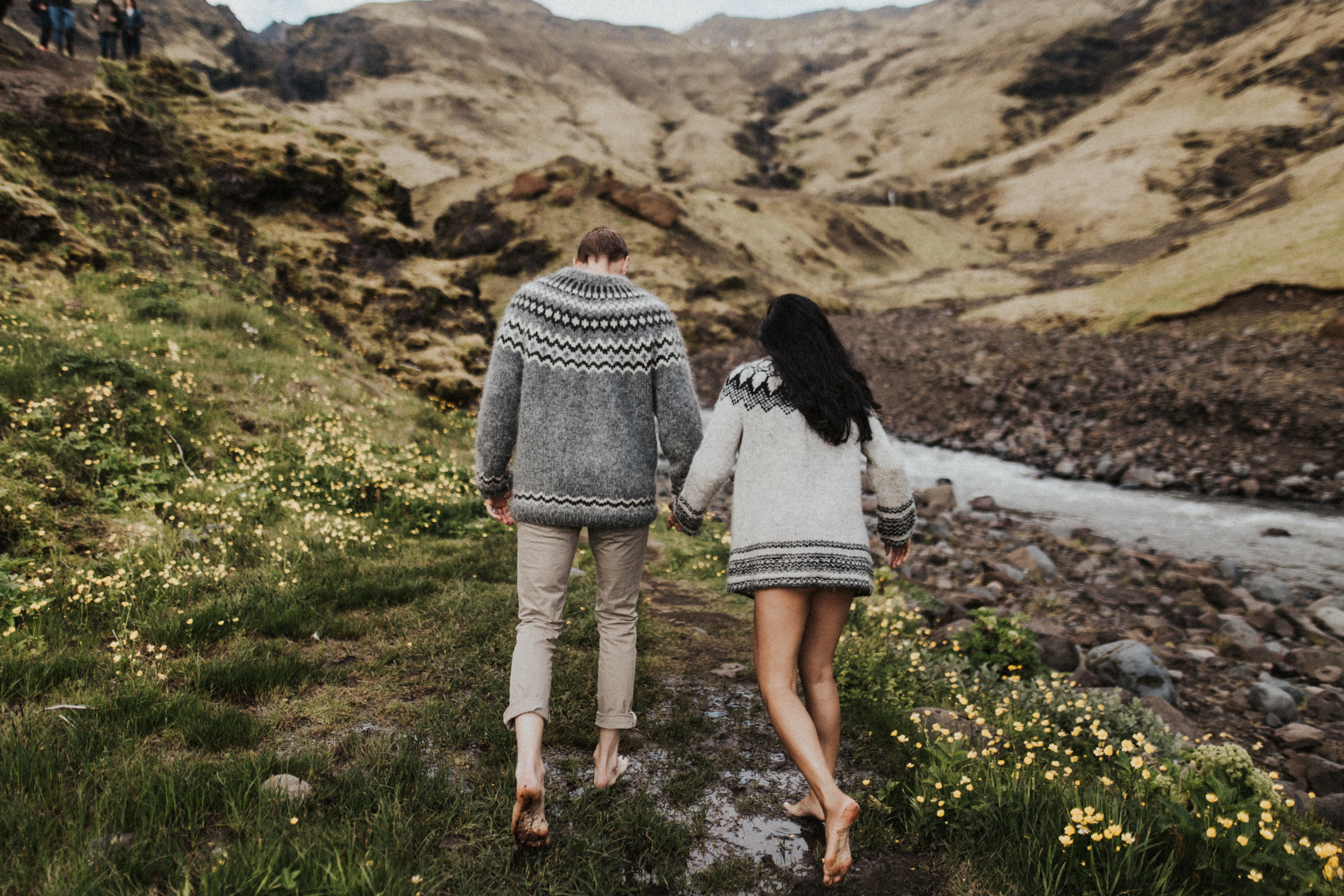 Barefoot couple walking around Iceland.jpg