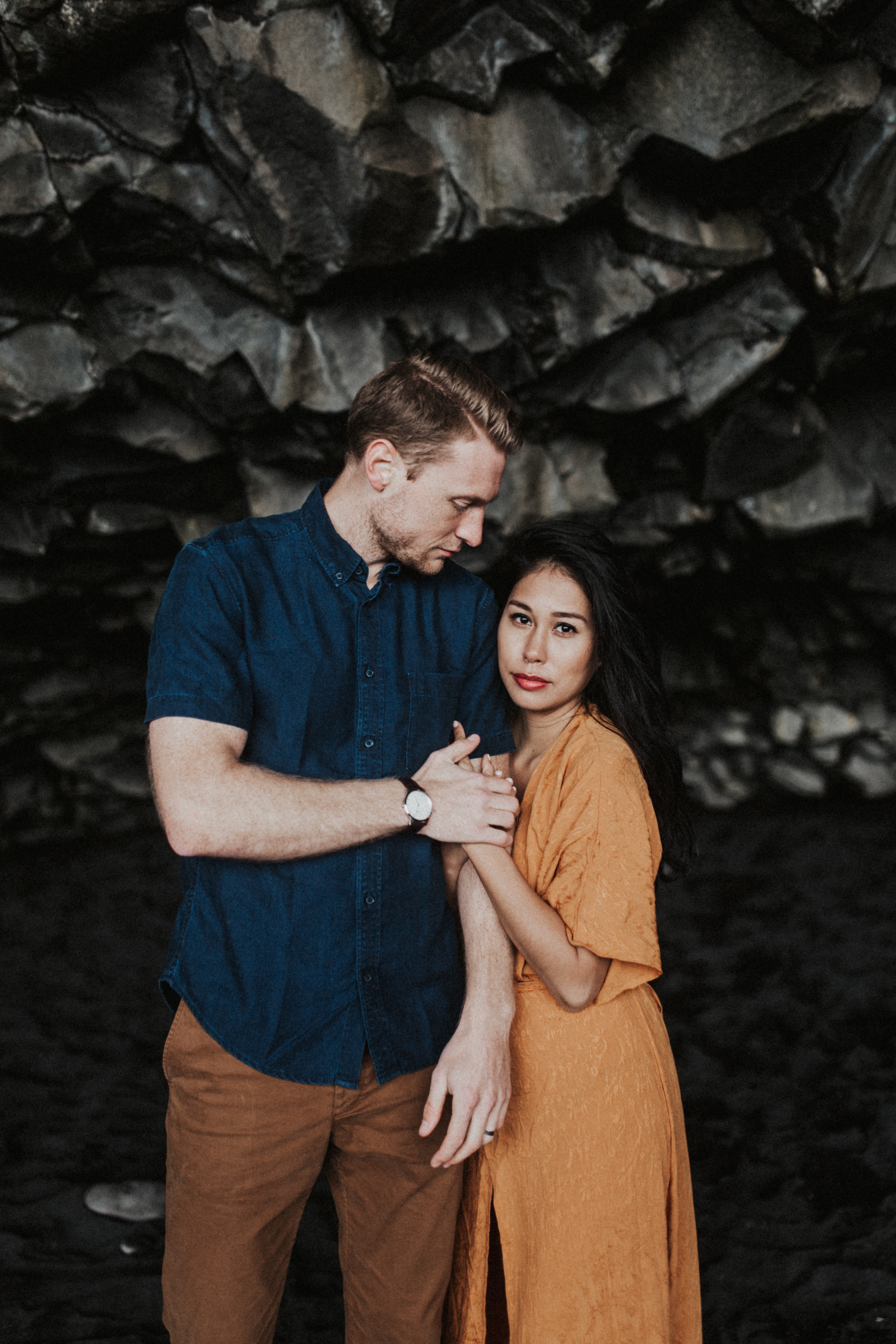 Stunning couple in orange and blue in Icelandic caves in Vik.jpg