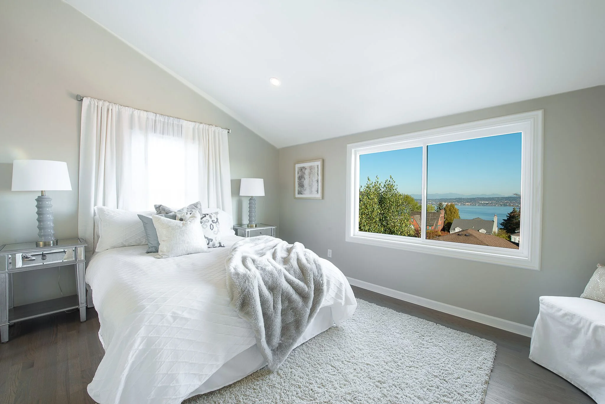 This cozy bedroom now feels spacious with vaulted ceilings and a new master bath.