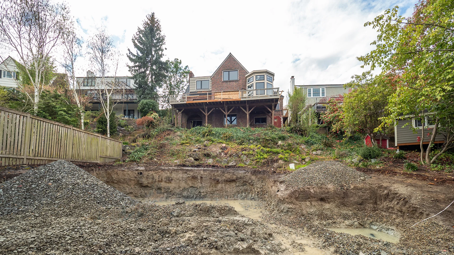 From muddy mess to necessary garage space, watch the transformation.