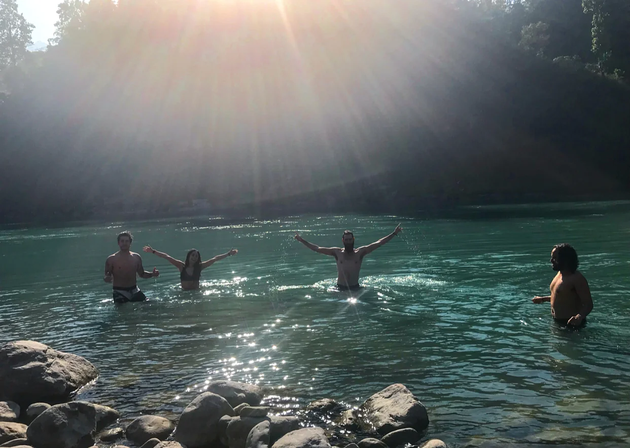 Everyone enjoying a dip in the freezing cold holy water!