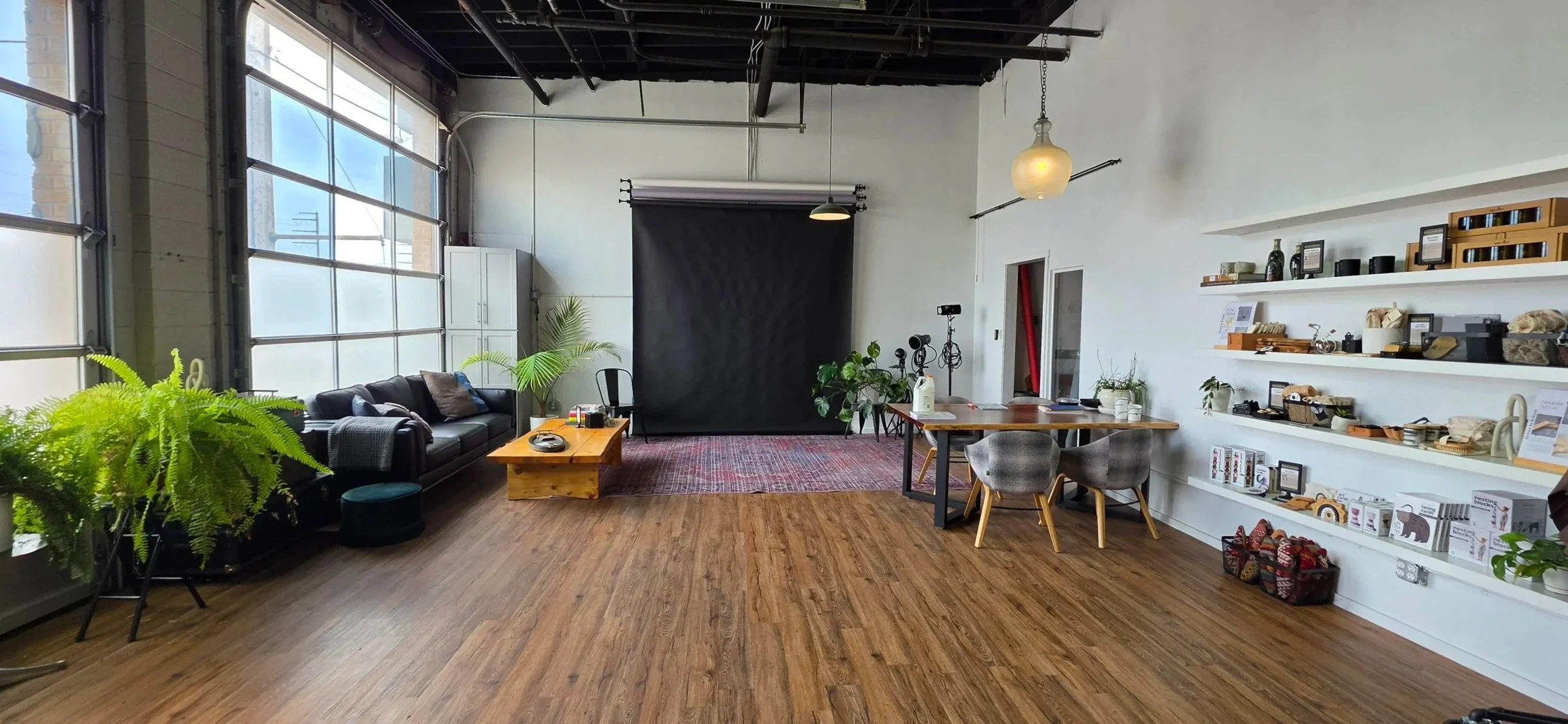 An interior photo of Grows As It Goes Studio & Showroom. This space is perfect for photoshoots, small events and workshops, the setting is creative and welcoming. Located inside the Prism Artist Workspaces.