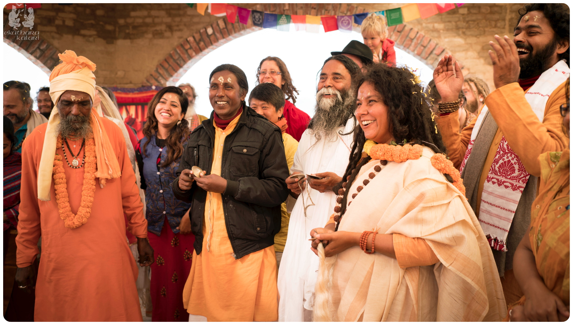Our dear teacher Parvathy Ma surrounded by Baul masters and new friends singing to Radha Krishna.