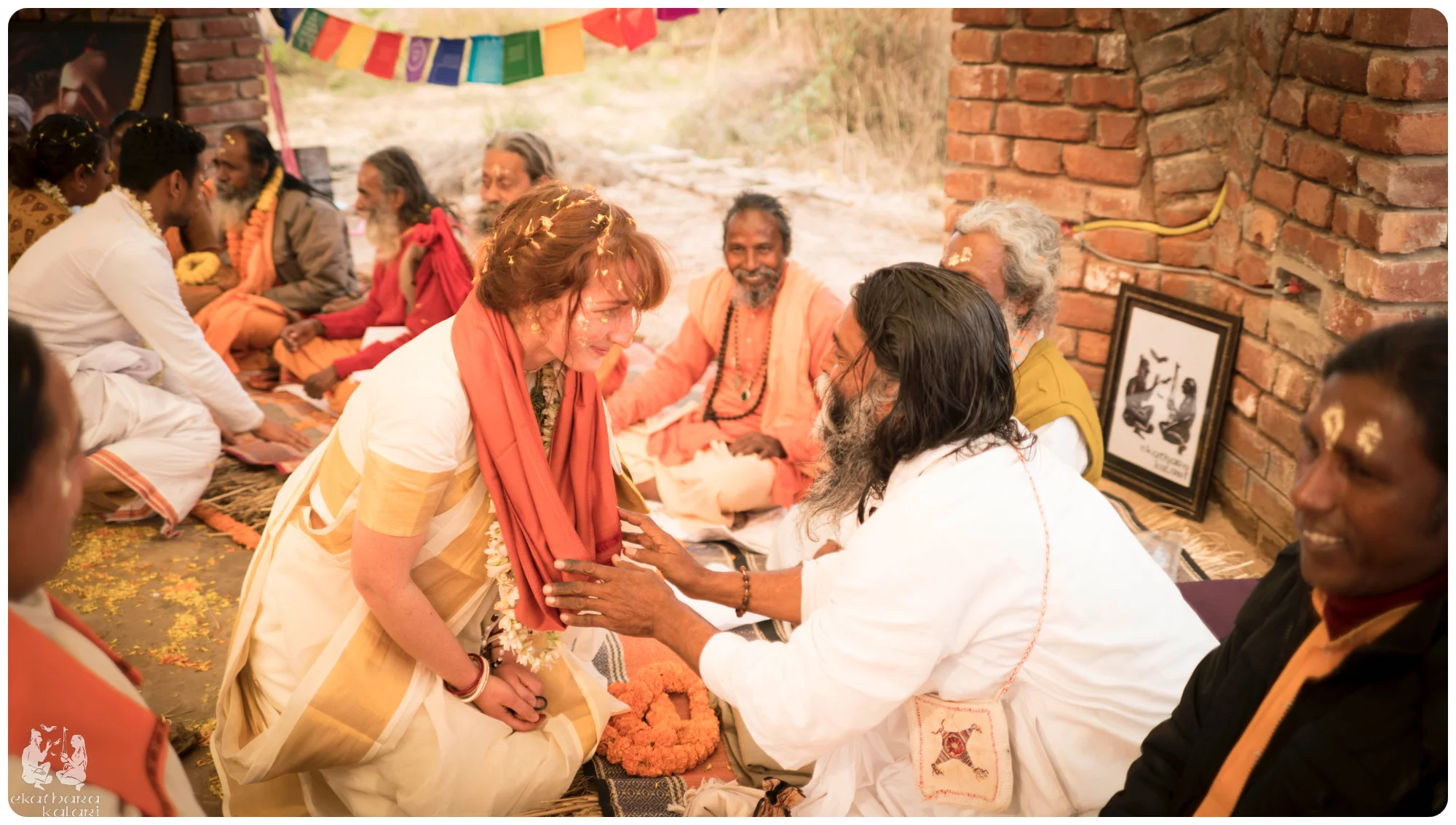 Emma and Bala offering pranams and donations to all the Baul masters for the many gifts of story, wisdom, song and love they shared with us. Here is Emma receiving a silk shawl from Baul Master Ananda Gopal das who acted as Bala's father for the ceremony. 