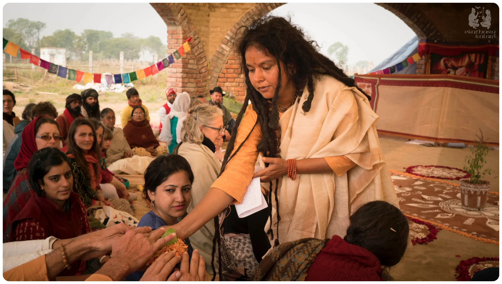 Parvathy Ma during the puja ceremony carrying our wedding malas to each guest to place their hands and offer blessings to our union.