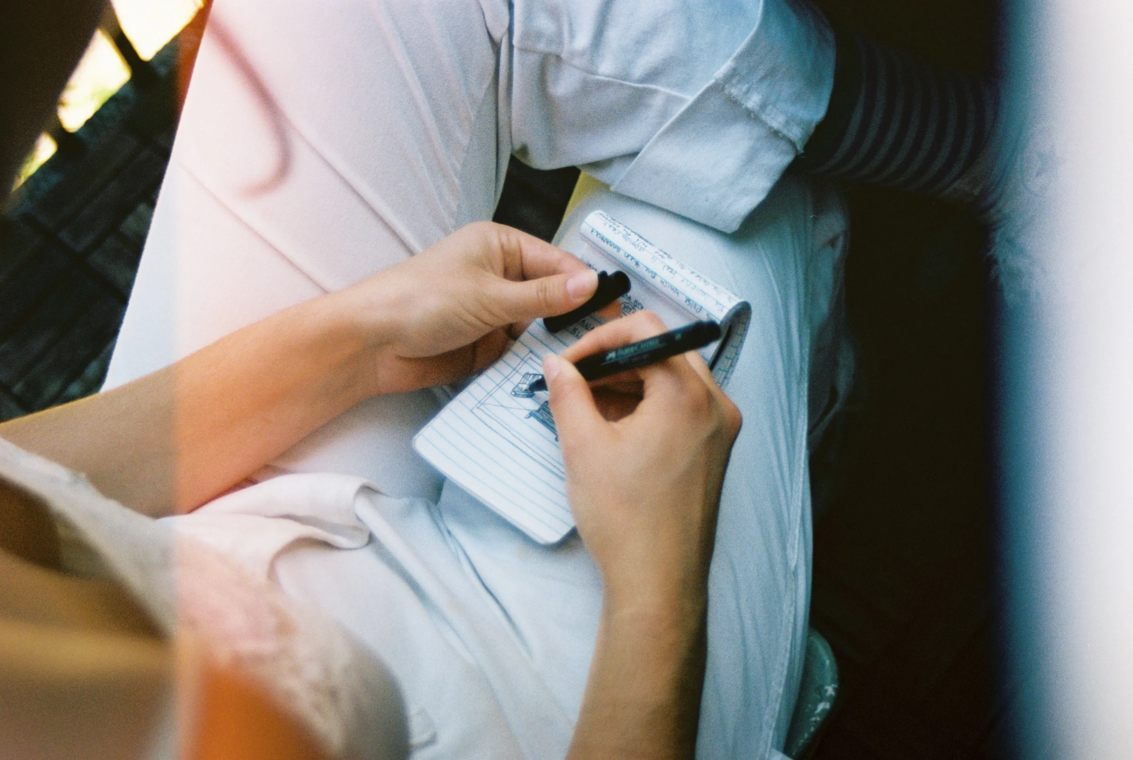 Peaches and her notebook captured by Natalie Yang.