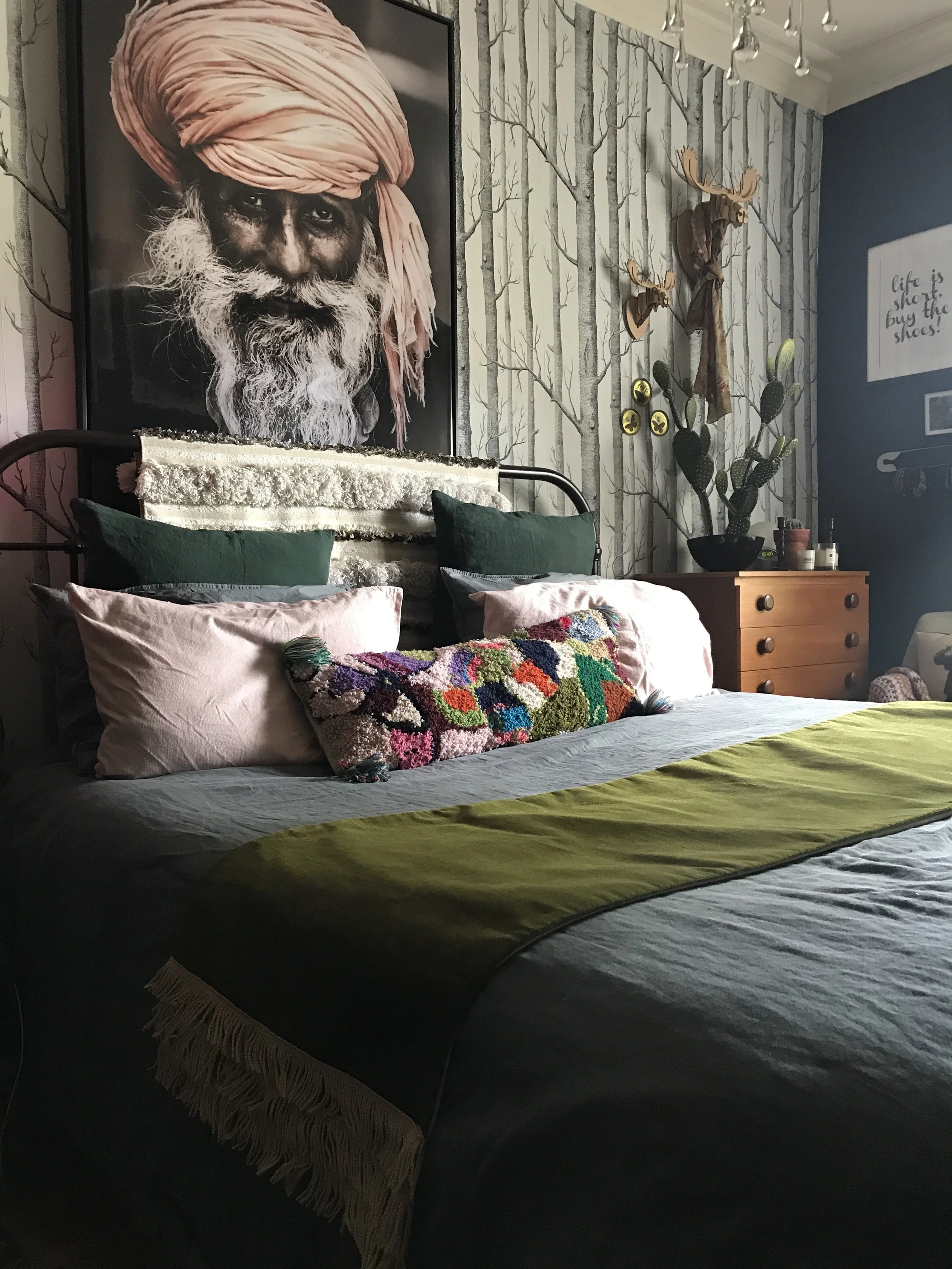 Picture 6. The main bedroom. The main picture is from Hilary and Flo , the wallpaper by Cole and Son , throw from Lauren Williams Art . Chest of drawers from eBay. Wedding blanket from Rockettstgeorge