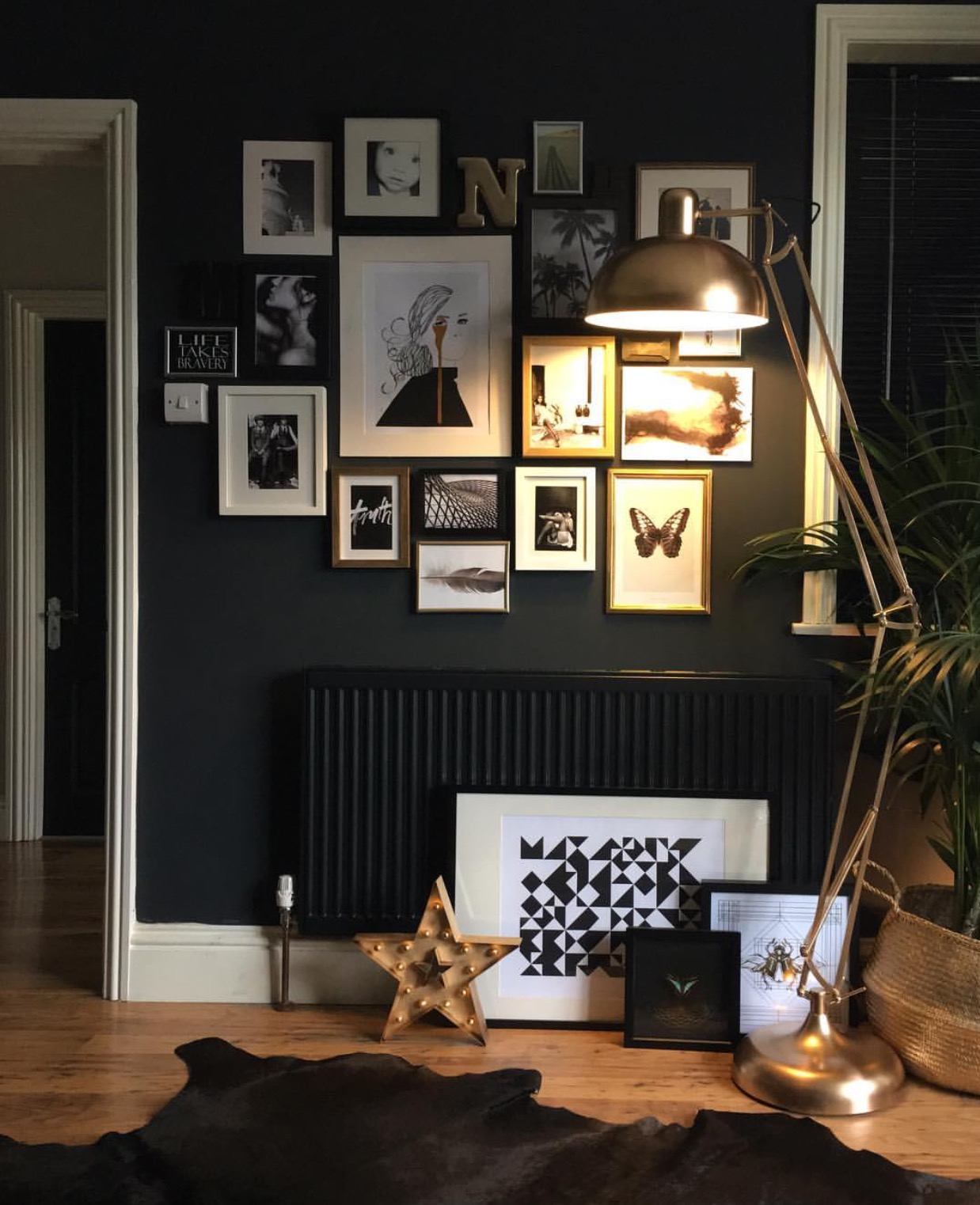 Another example of a beautiful gallery wall. "This wall had been bare for ages apart from the odd piece of art hung every now and then," Nadia explains. "I found old pictures in many different places, bought new pictures, and collected bits and pieces... I have a thing about gallery walls not having gaps, I don't know why, I've always done it that way. I like them to fit like a mosaic, but that's just me."