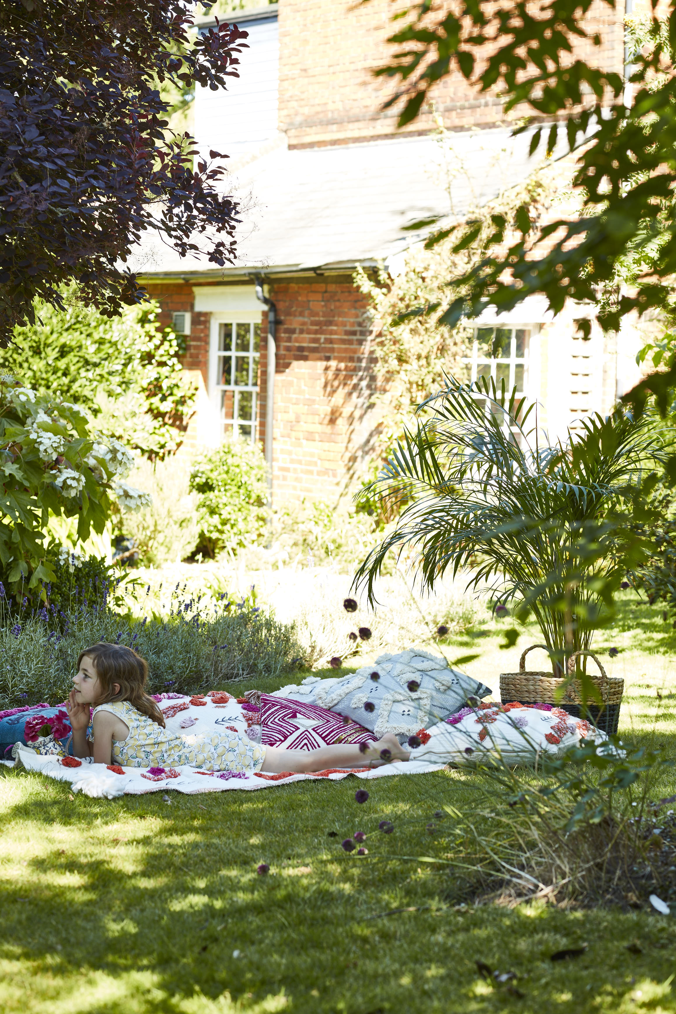 All cushions from Anthropologie . Wicker basket, H&M