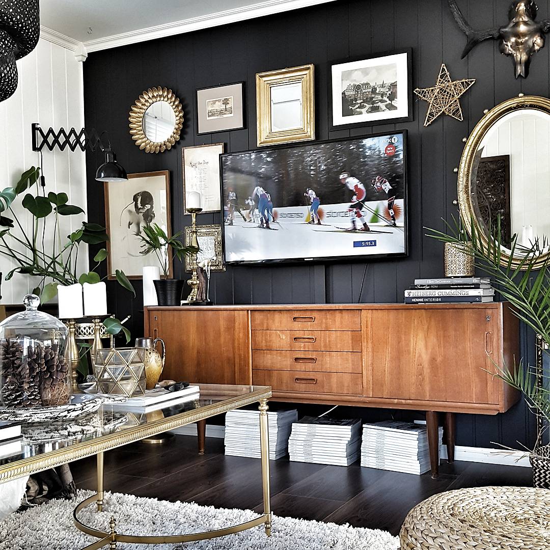 Hildegard's favourite rooms are the living room and kitchen. The Black wall really allows the art to stand out and is beautifully complimented with the vintage sideboard.