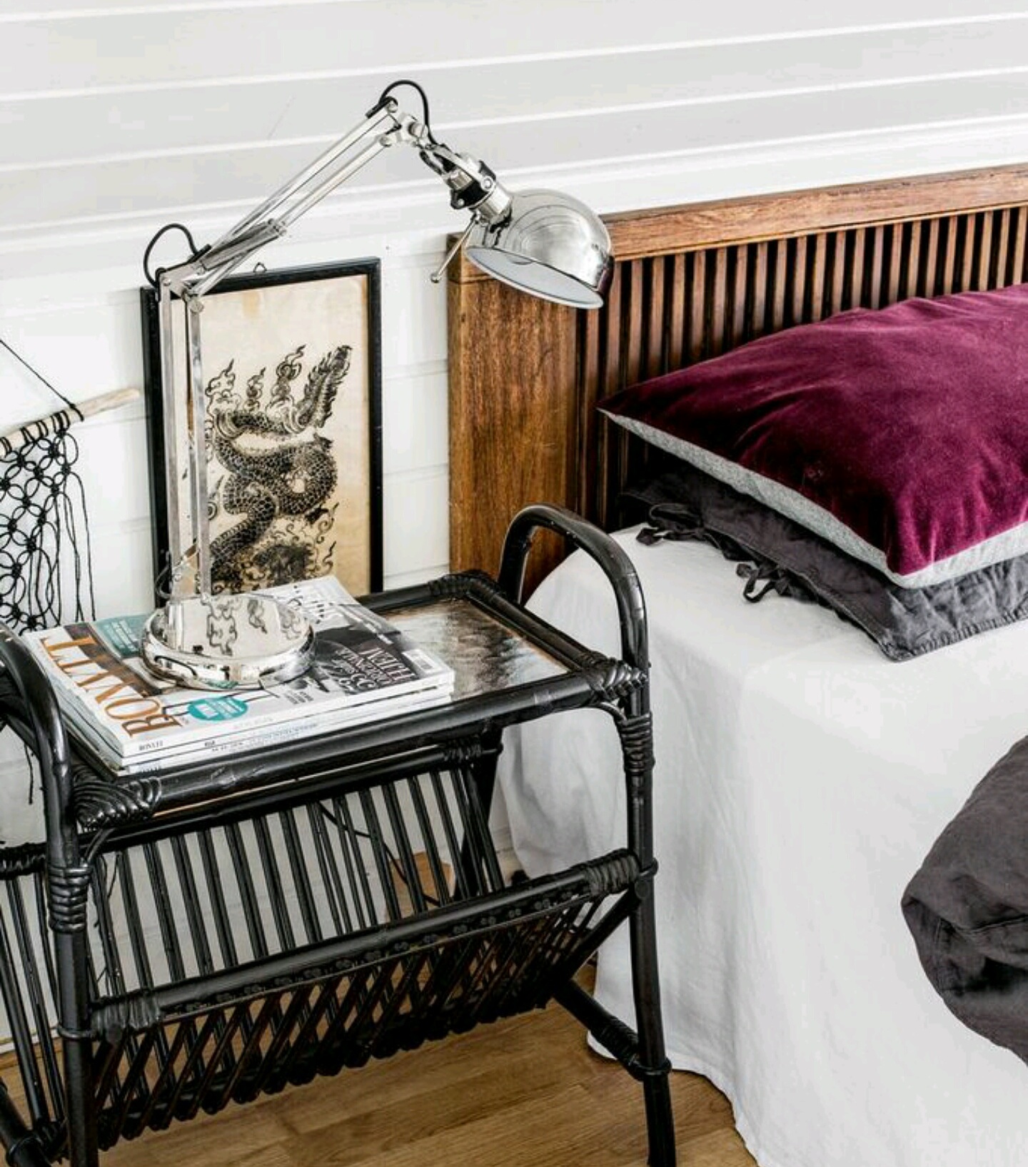 The couple's bedroom is bright and airy. The bedside table is another flea find that Hildegard painted.