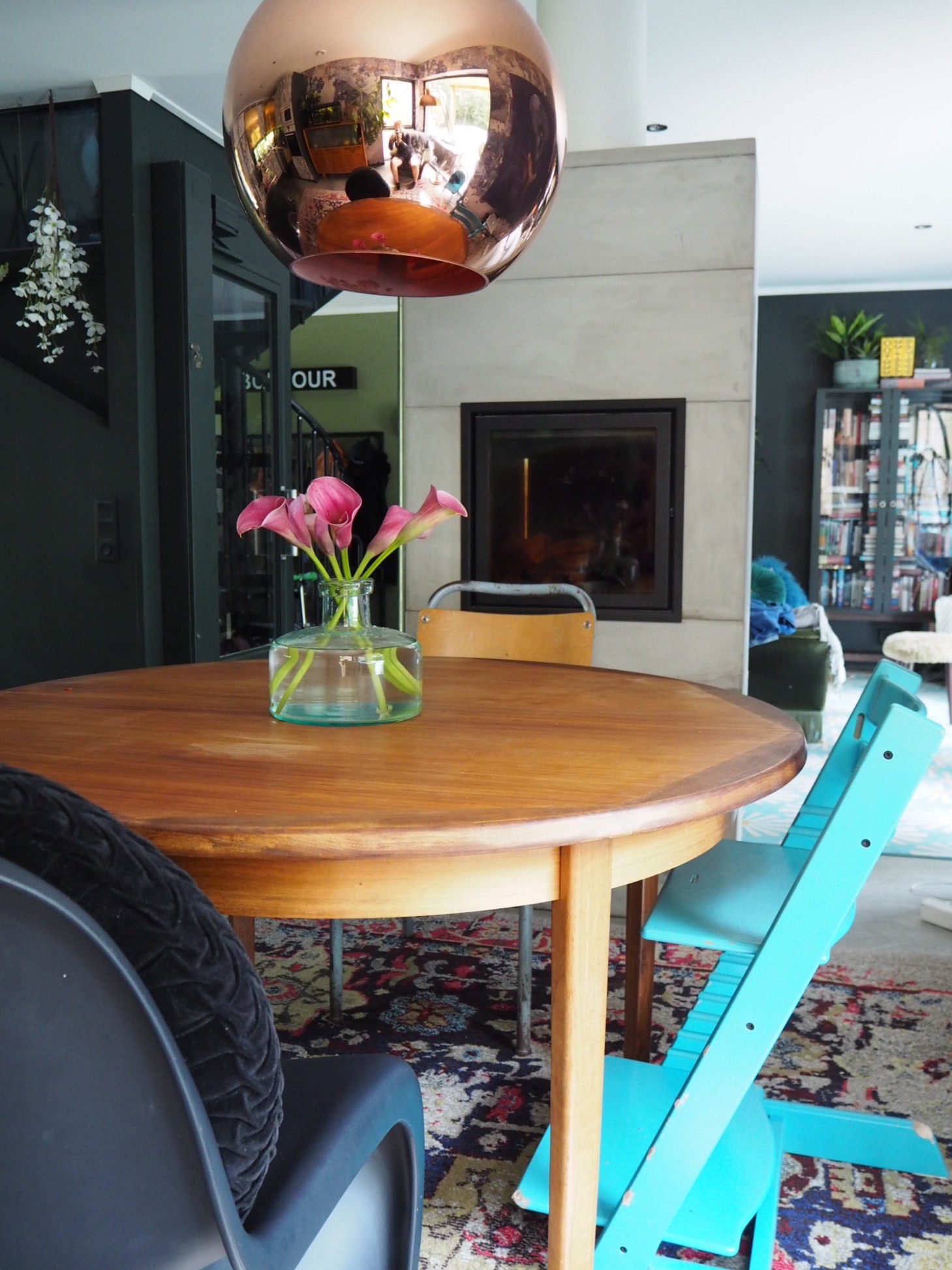 mismatched chairs give an eclectic look to the dining room