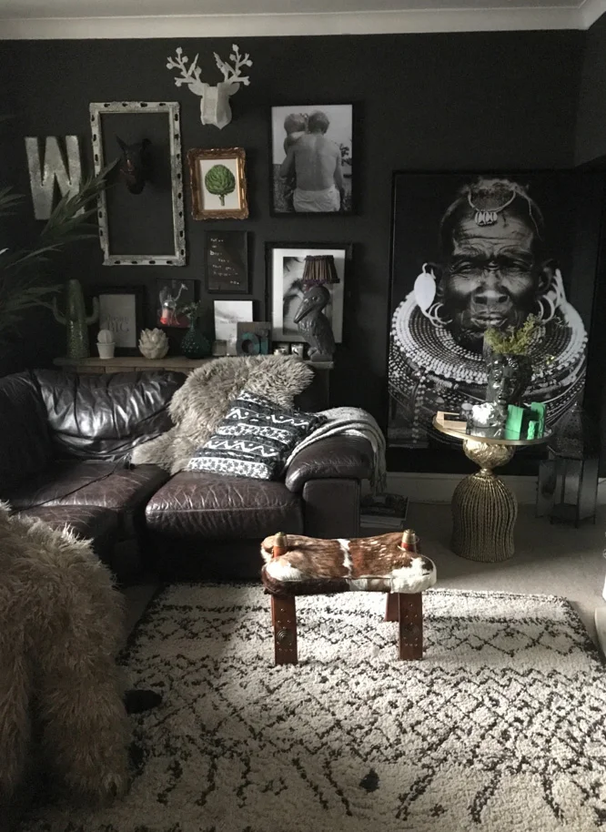 Shelley's living room where you can see some of the art she sells in the shop. If you've ever asked about the indian man print behind my bed, in our master bedroom, you can source him here, along with the equally dramatic picture you see here.