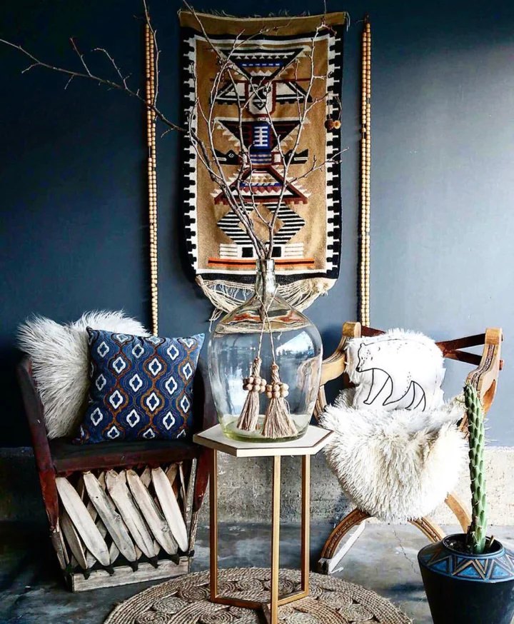 Vintage furniture against ethnic art and cushions