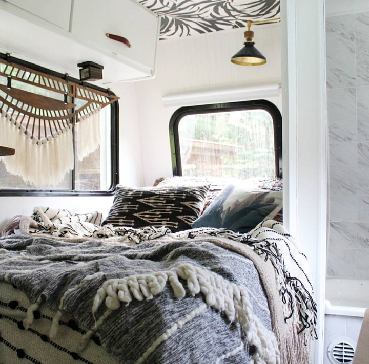 We had a custom mattress made from Brentwood home and it was the best decision. Having a comfortable bed makes such a difference and really makes the RV feel like home and a place we look forward to staying in. We brought in our favorite bedding to help as well. The blanket is from Shop Viariaz , the large pillow from ShopFleaMarketFab , one from Swoon Rugs and three from dkrenewal . We added the sconce in the bedroom from Rejuvenation as well, it’s the only new light we added but helps in making the space feel more like a home and less like an RV.