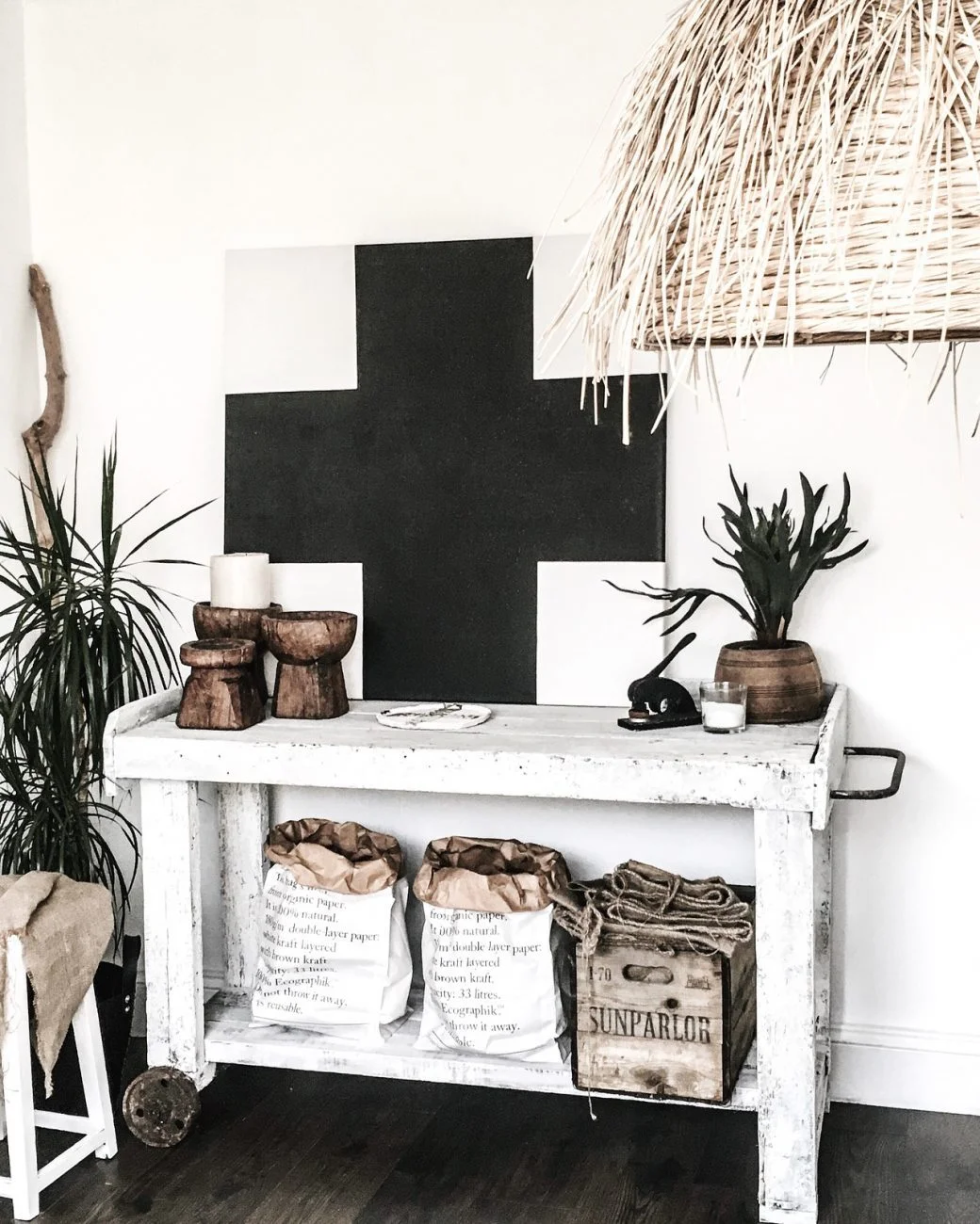 Rustic boxes and brown wooden candle holders add texture to this room.