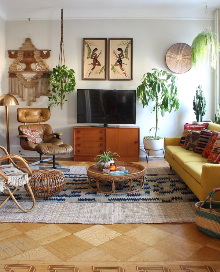 Mis-matched furniture, mid century finds, plants and textiles create a relaxed vibe in this room