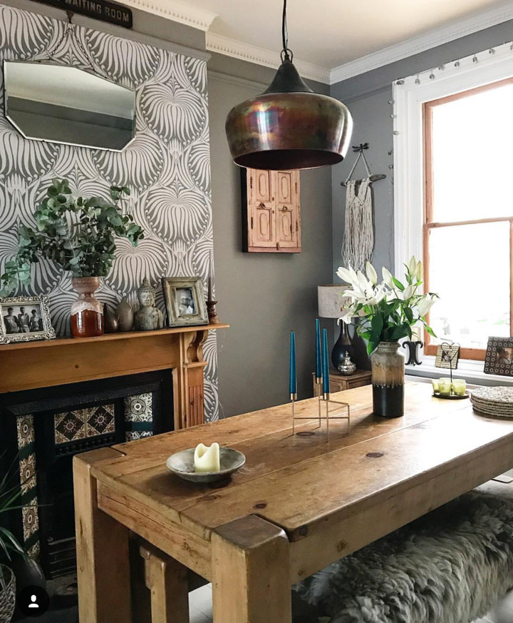 A rustic table with Industrial lighting.