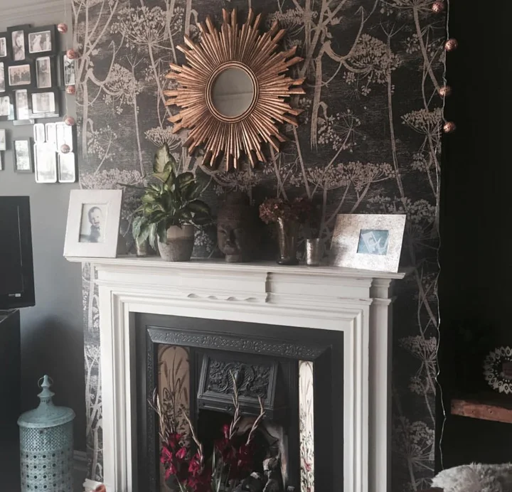 Cole and Son Wallpaper above the fireplace in the living room