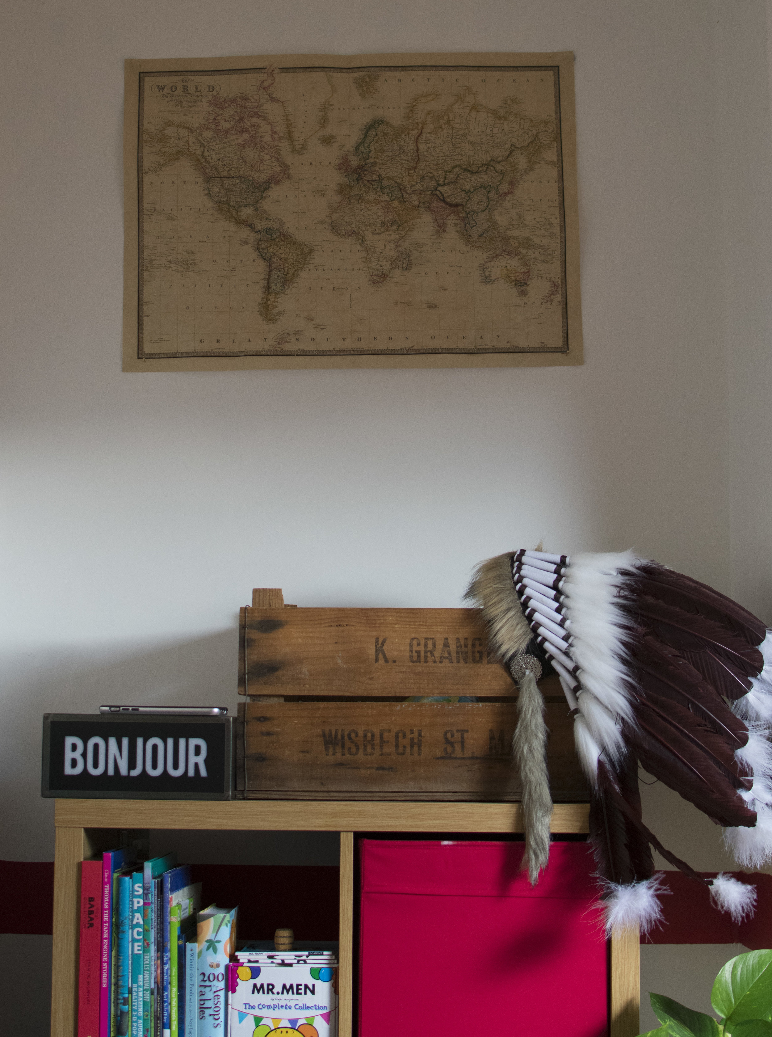Old Apple Crates used as storage, an Indian Head piece sourced from etsy and the Bonjour Lightbox from Mandrawer new homeware collection