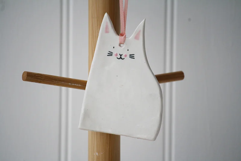 hanging natcat white close up Natcats Cats.jpg