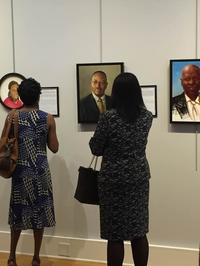 One of the Emanuel ministerial staff looking at Reverend Pinckney’s portrait