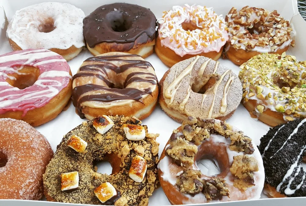 Top row (left to right): lavender lime, salted chocolate, strawberry toasted coconut, maple pecan. Middle row: raspberry almond butter, mocha, dirty chai, lemon pistachio. Bottom row: cinnamon sugar, s'mores, cookie dough, cookies n cream.