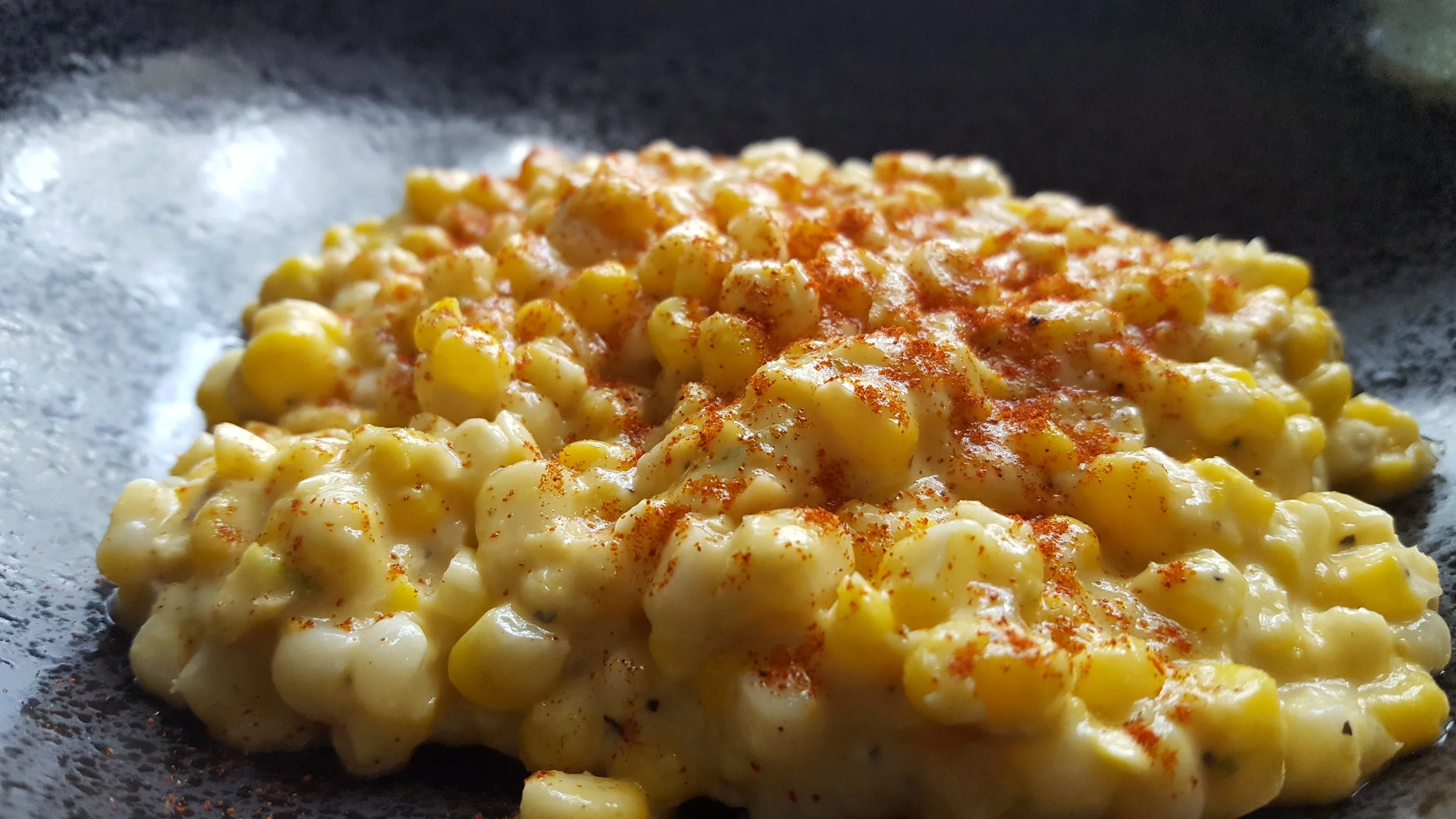 Sexy chipotle powdered dusted atop a cup made of corn and mayo and love