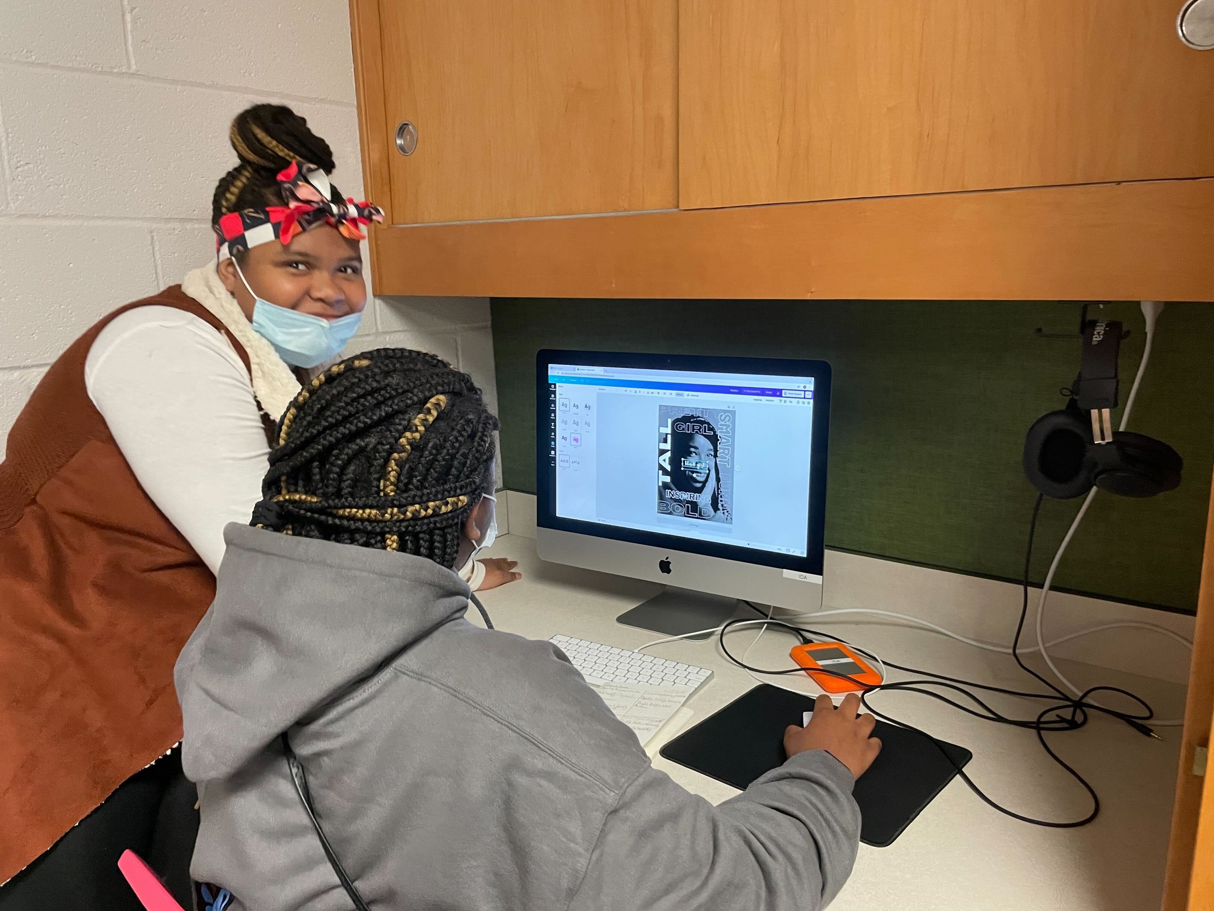 Students creating their typography portraits on the computer