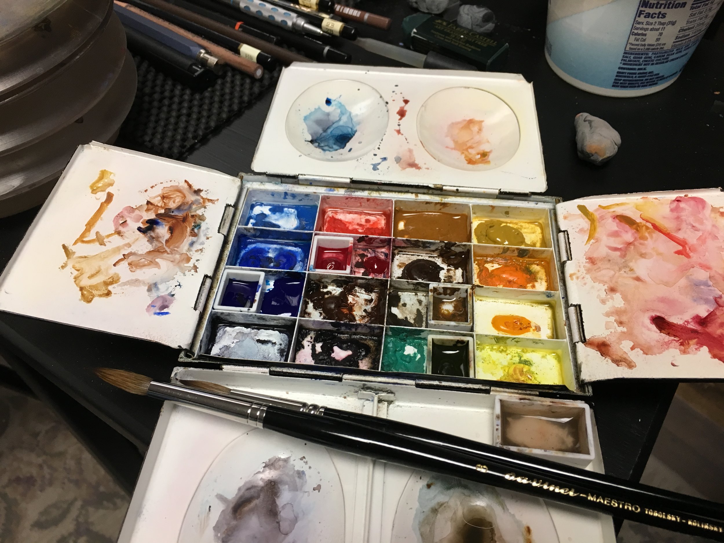 Watercolor palette and brushes