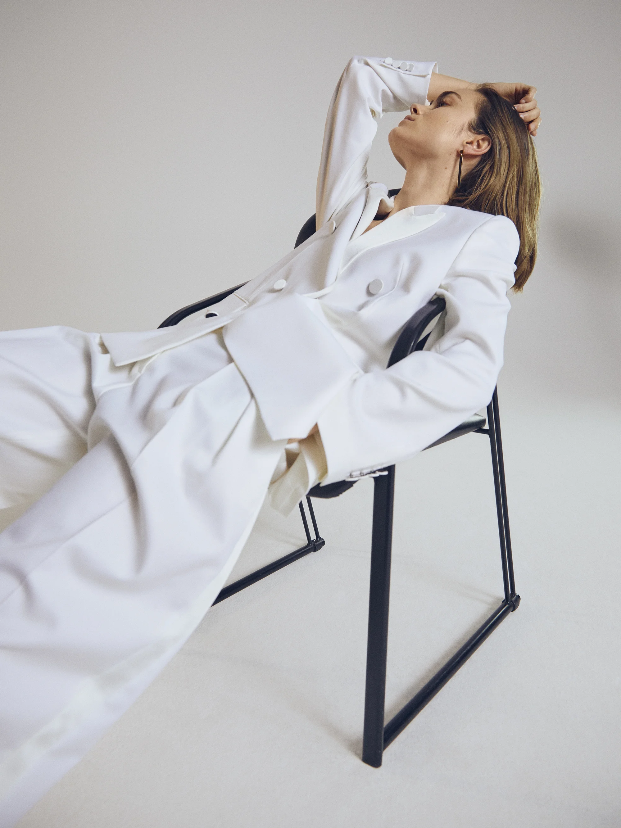 White suit BOSS . Earring Cos