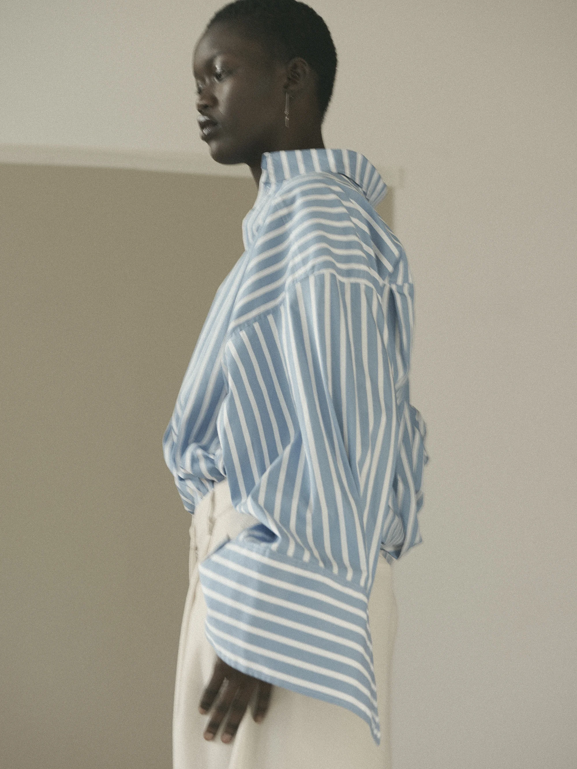 Oversized striped shirt with oversized cuffs Schuellerdewaal . Off white oversized pants ESSENTIAL ANTWERP