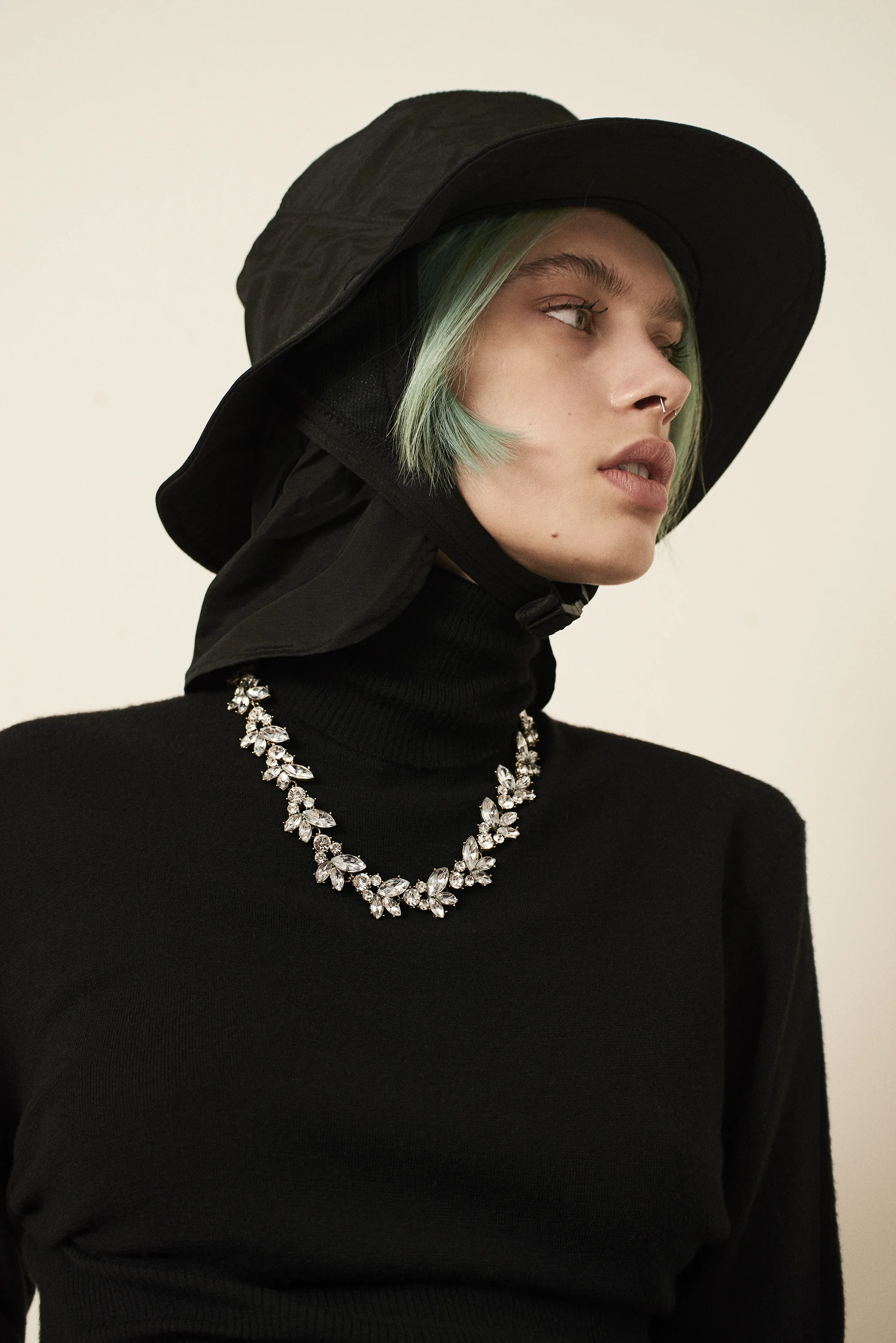 Turtle neck sweater Saint Laurent . Hat Dakine . Necklace Givenchy