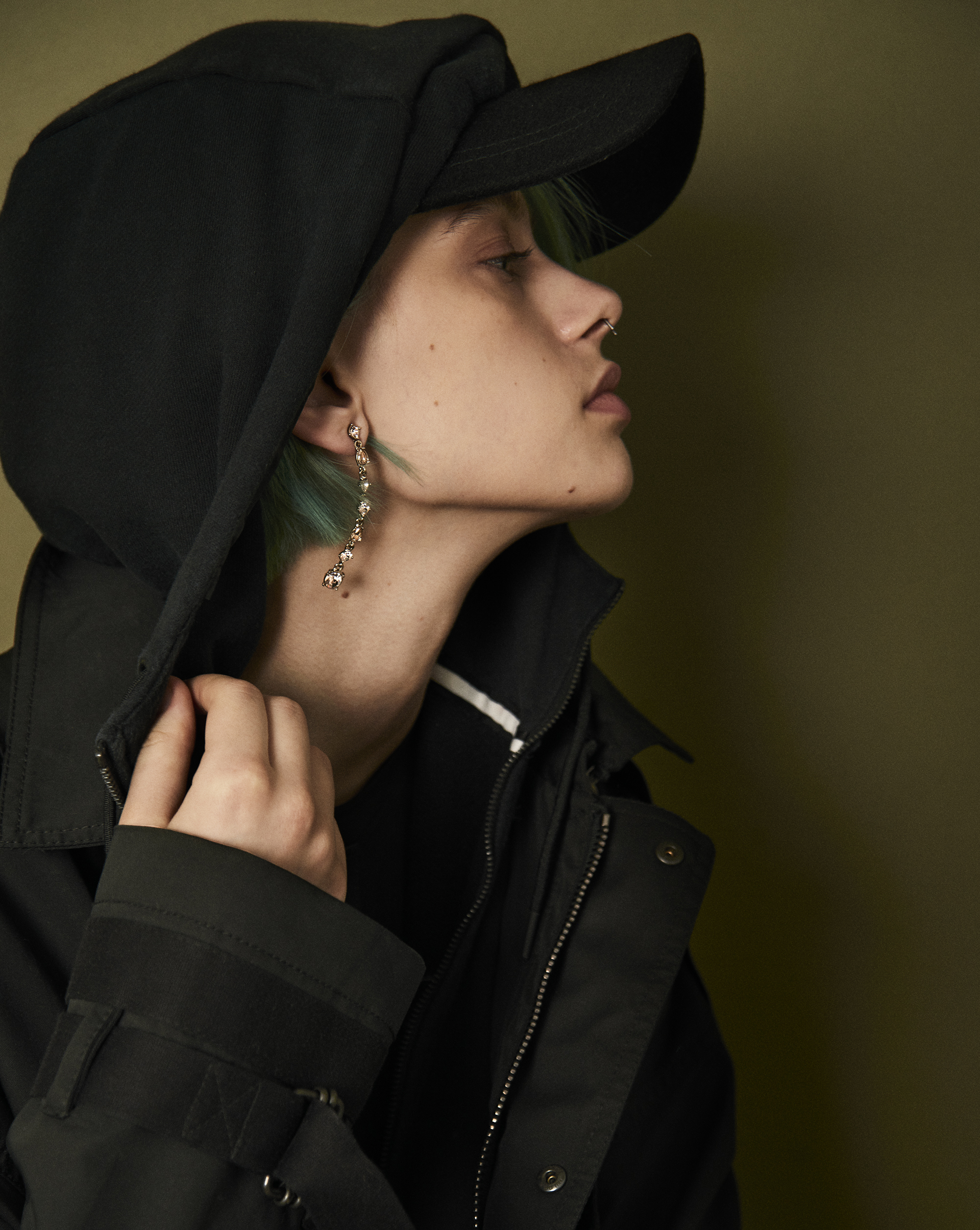 Hooded sweatshirt Nike . Jacket Diesel Black Gold . Earring Givenchy . Wool cap Epoch