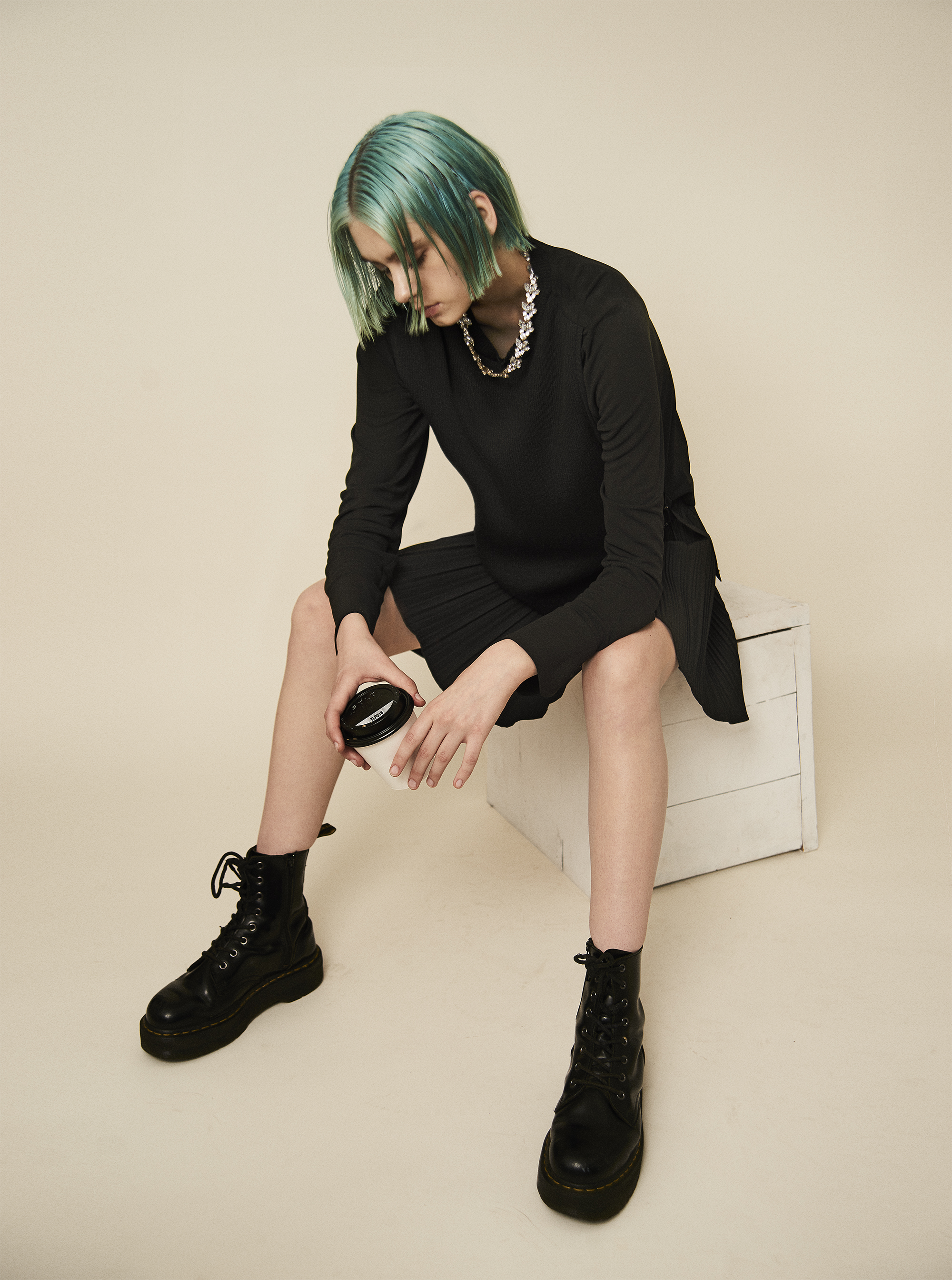 Blouse Lie Sangbong . Pleated skirt Versace . Necklace Givenchy. Boots Dr. Martins